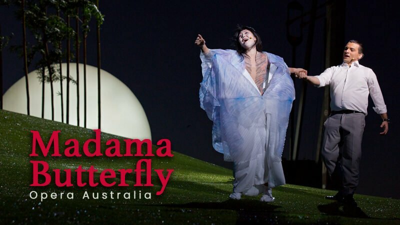 Soprano Hiromi Omura sings in an open kimono while another singer holds her back. Leads to Opera Australia’s Madama Butterfly.